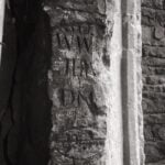Writing carved into the window of Pencoed Castle Gatehouse